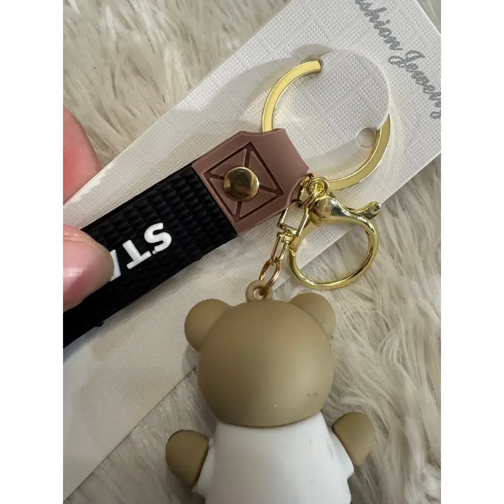 Starbucks bear black keychain with white sash and black Starbucks logo